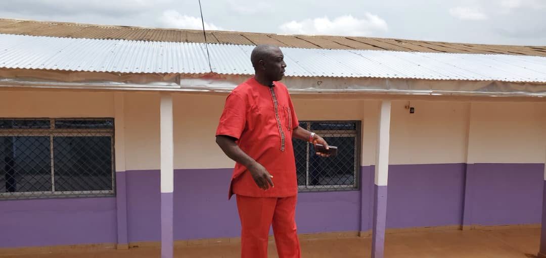 The Principal, Dr. Mbaku Henry, on a walk through the campus